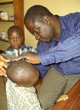 A doctor examines a boy